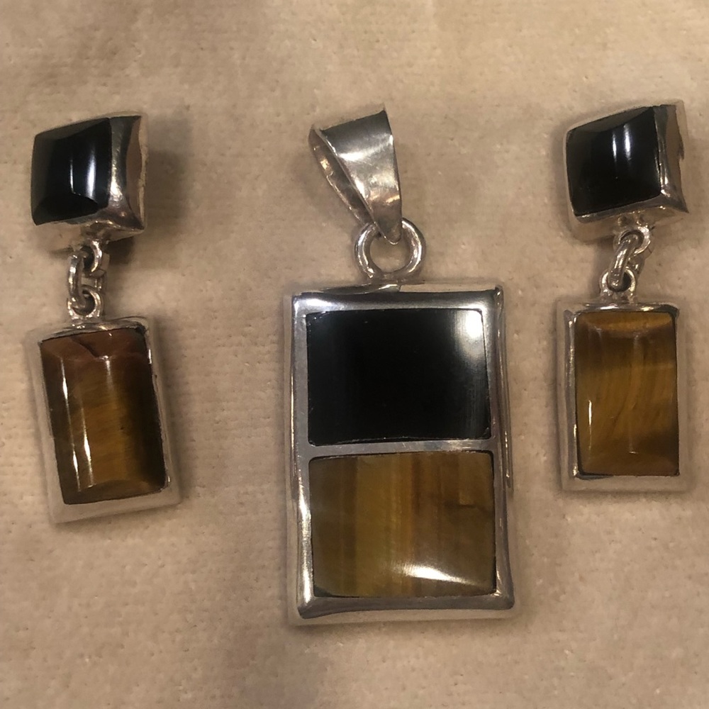 Sterling Silver pendant and matching earrings.